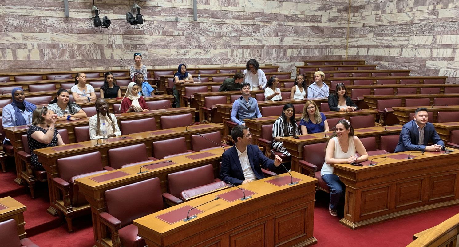 A group of Law summer school students sitting in the Hellenic Parliament in Greece