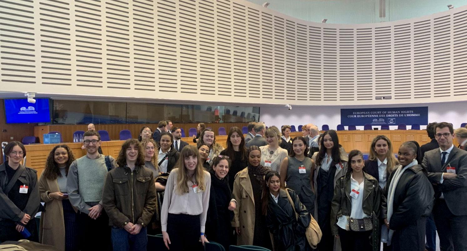 Around 20 law summer school students in a big atrium space at the European Court of Human Rights