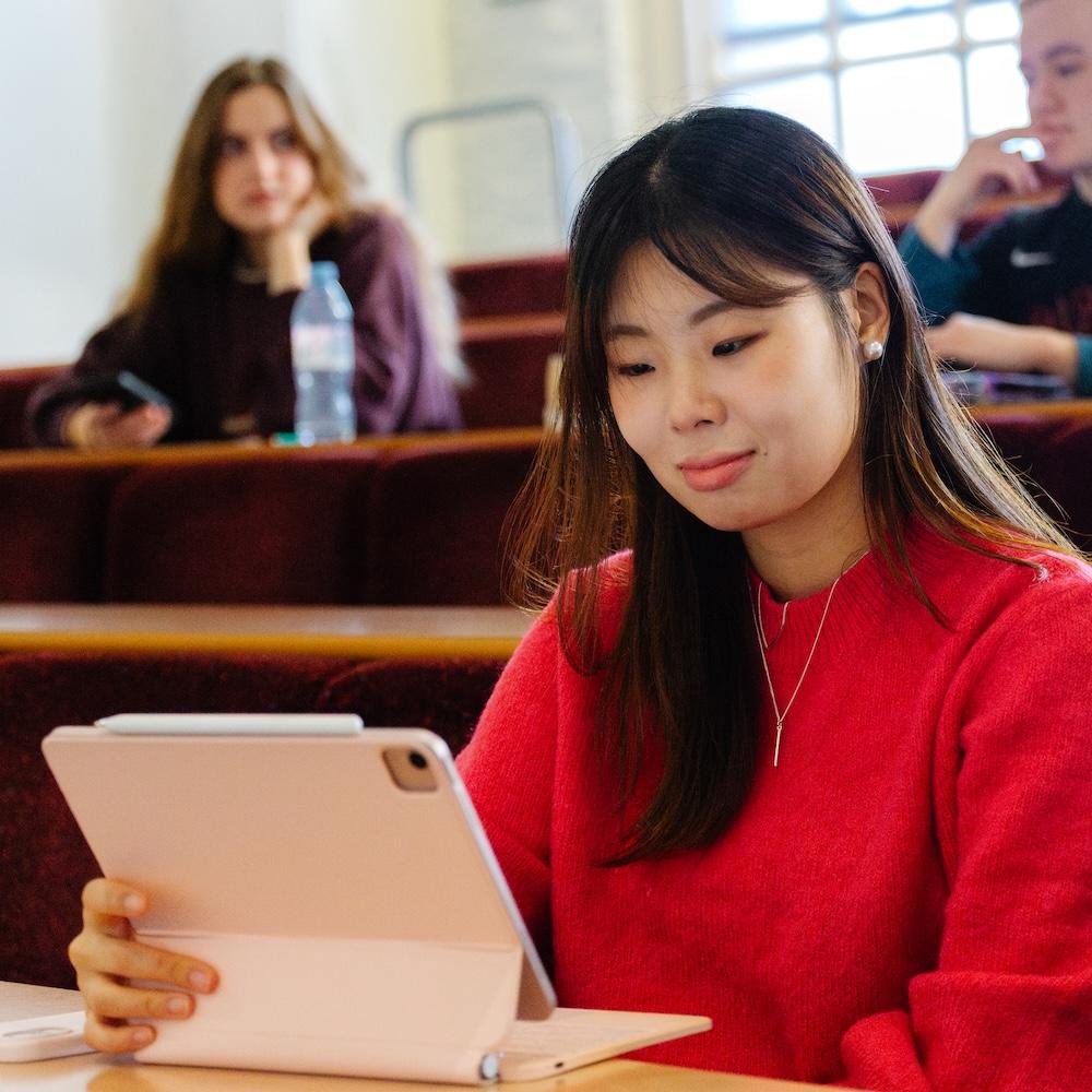 A student working on a laptop.