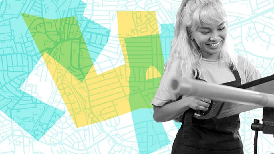 Woman using a saw in the foreground, graphic background