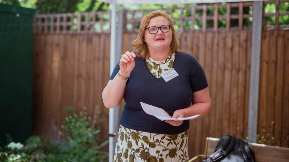 Female speaking and gesturing
