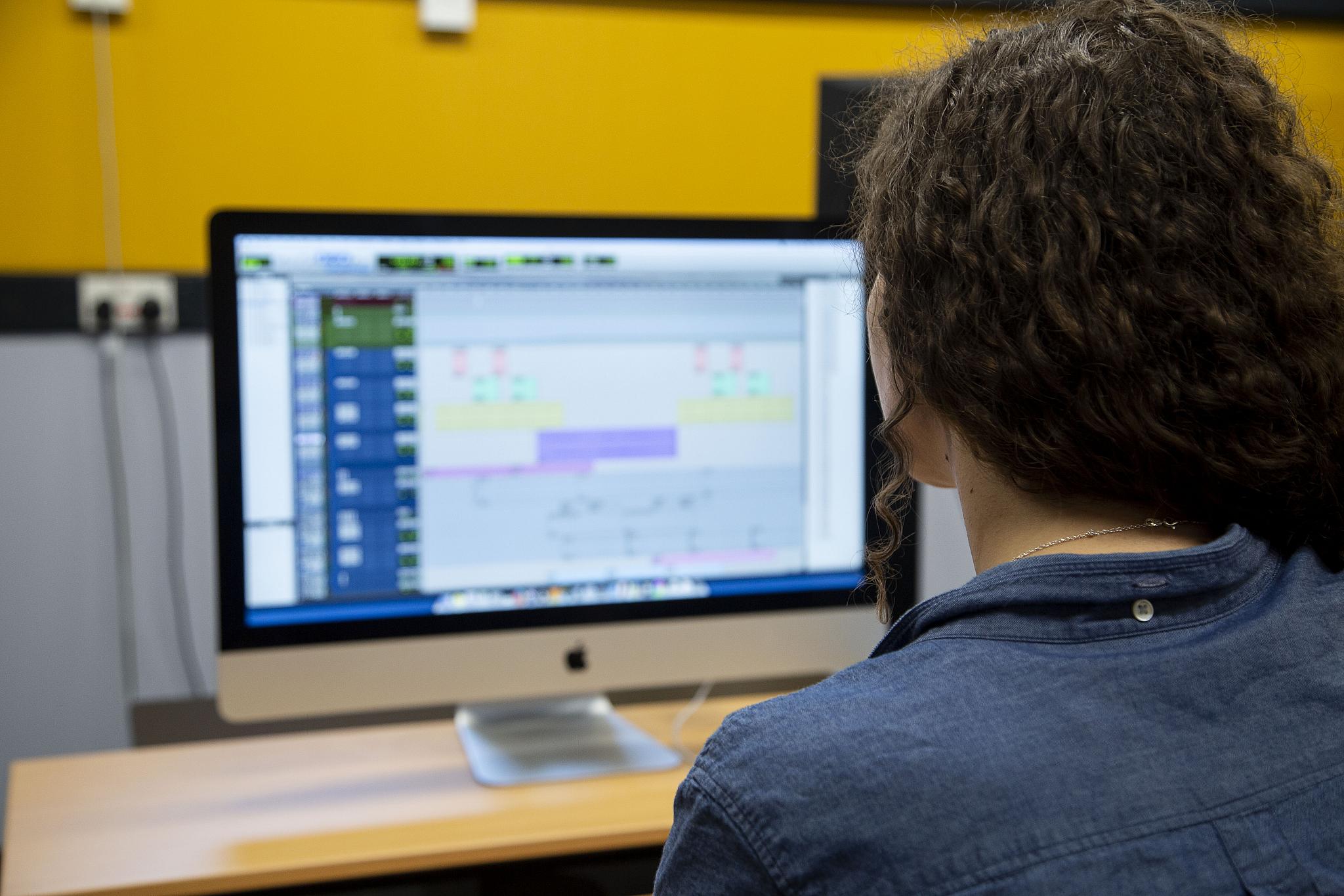 A student working in the Electronic Music Studio.