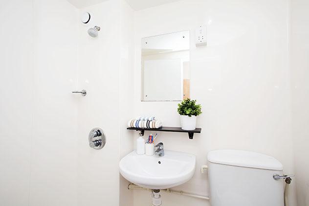 Inside a student halls bathroom with sink and toilet