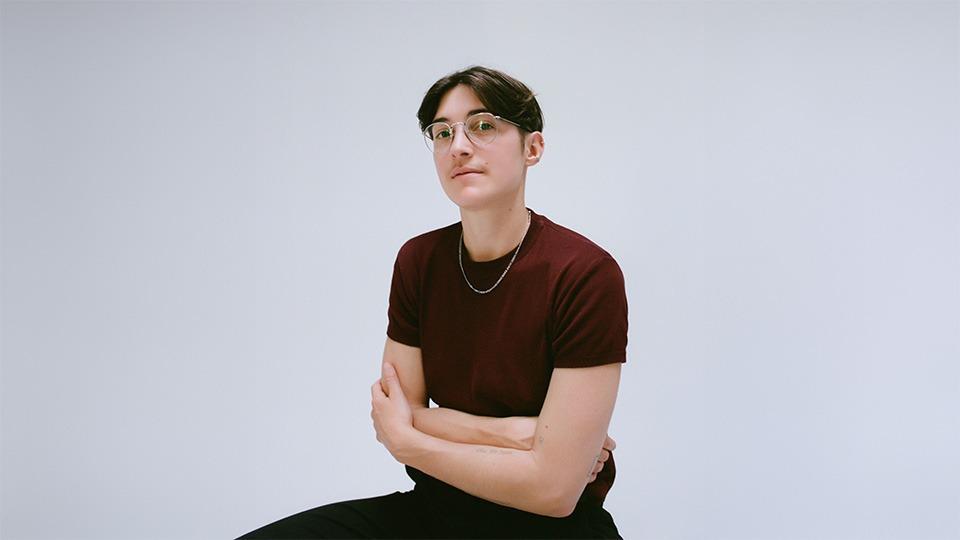 A portrait of Floriane Fo Misslin wearing a dark red T shirt 