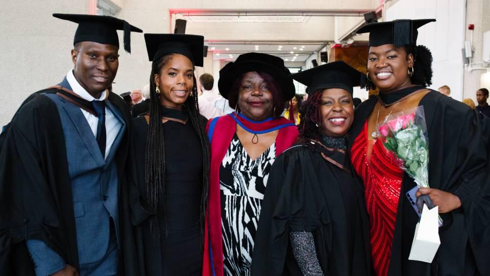 Students and Dr Marl’Ene Edwin celebrate at the 2024 summer graduation 