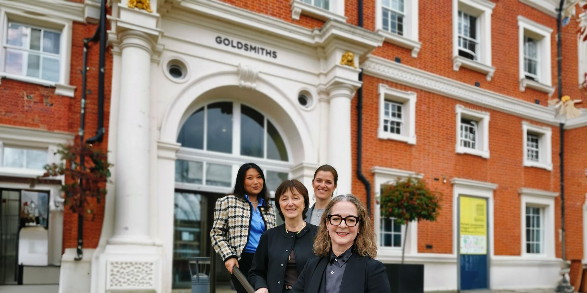 four women standing outside the Richard Hoggart Building