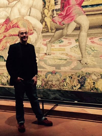 Man stands in front of painting