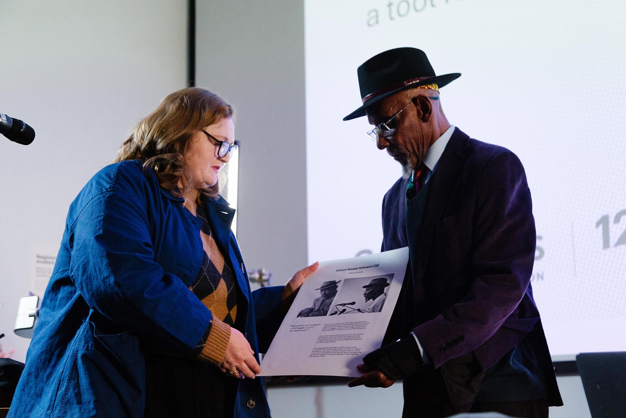 Deputy Vice-Chancellor, Prof Annabel Kiernan presents LKJ with a commemorative plaque