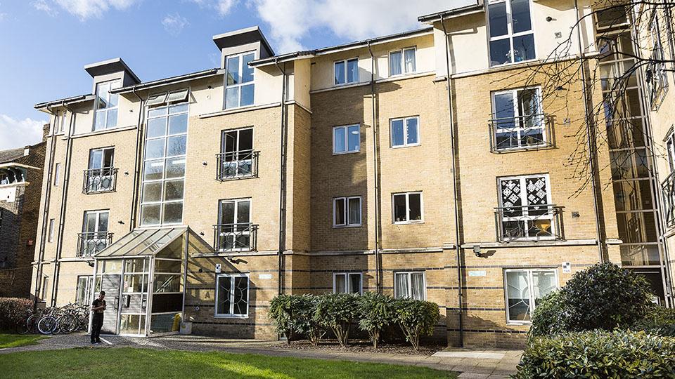 Outside Loring Hall a multi-storey student housing block with grass outside