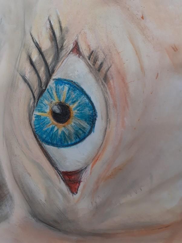 This drawing of an eye created using colouring pencils was created by John.