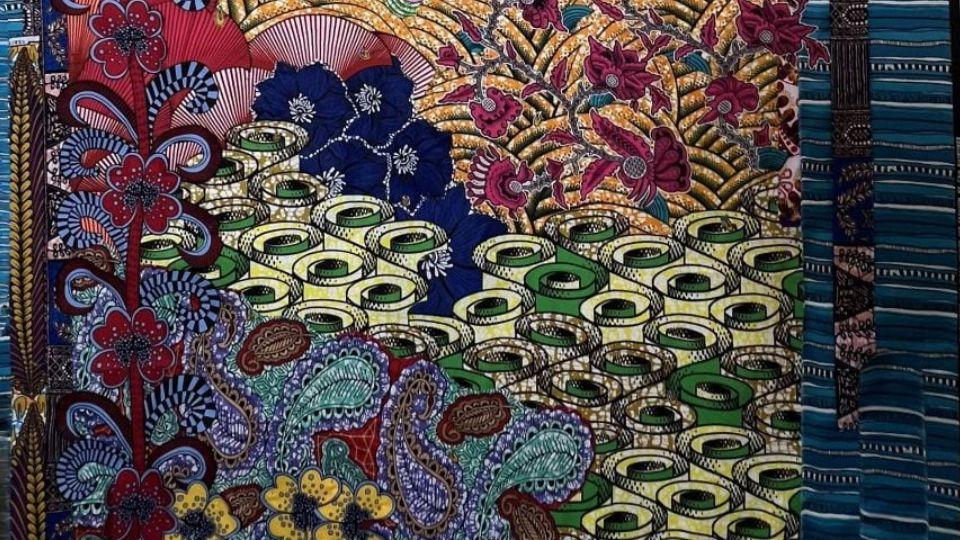 Artwork comprised of layered West African fabrics 