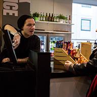 A student working behind the counter at the cinema