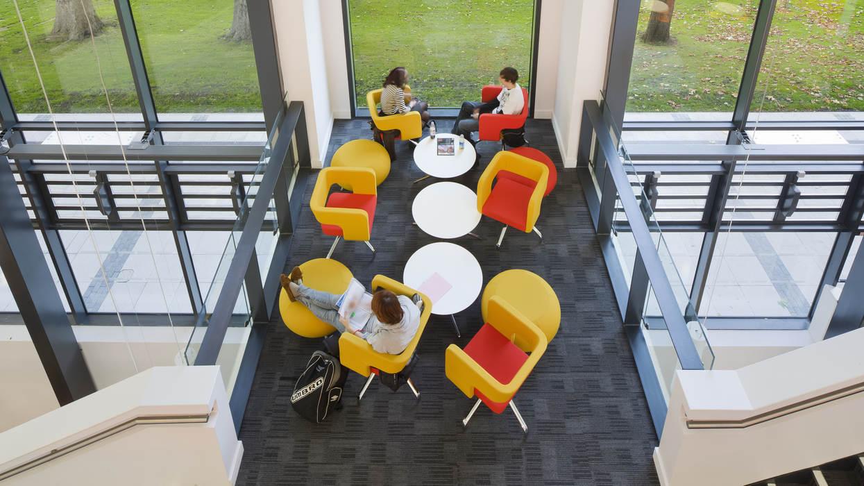 Students rushing through the red corridor in the Richard Hoggart Building.