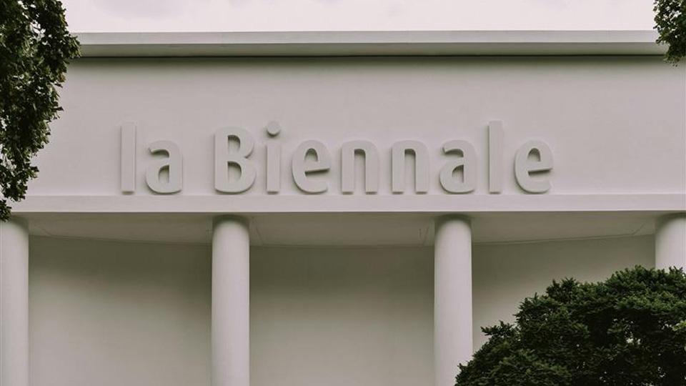 A sign on a building which reads La Biennale in white letters 