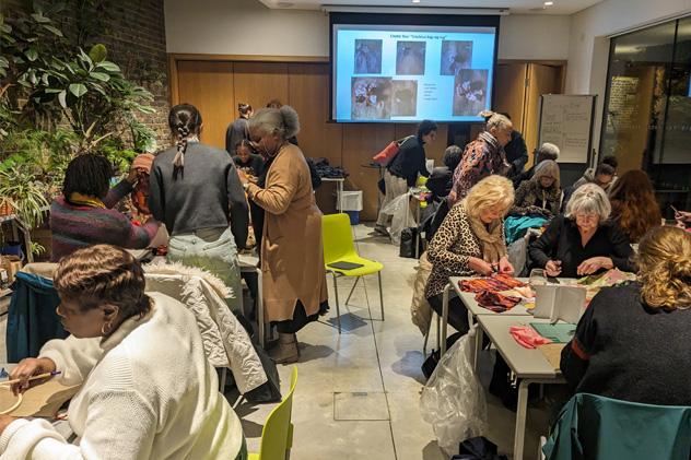 People take part in a crafting workshop at a museum late