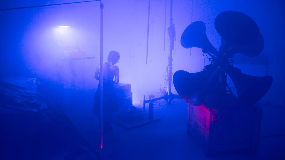 installation of gramaphone speakers in blue-hued gallery space