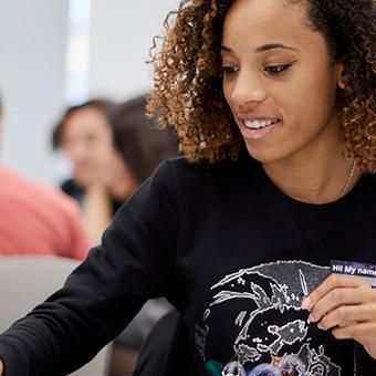 Smiling girl sitting at a desk