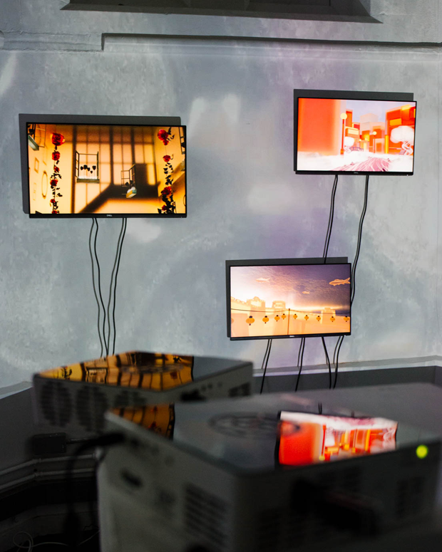 An image of multiple screens displaying artwork against a grey background, from a computing degree show.