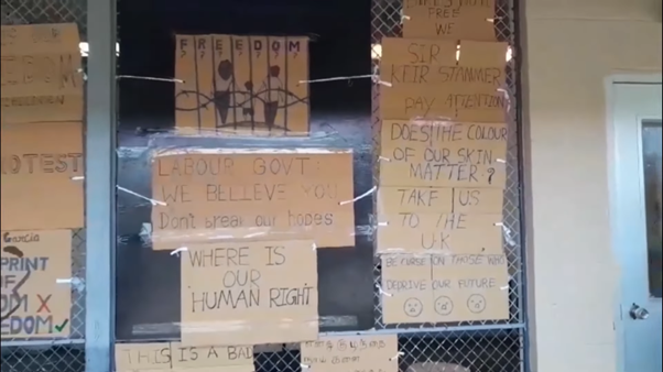 A collection of protest posters on brown card 