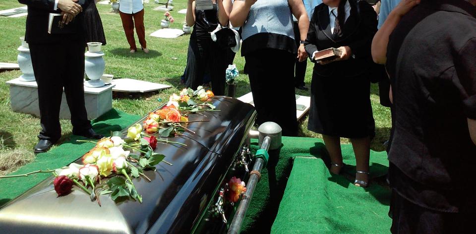 A group of people attending a burial